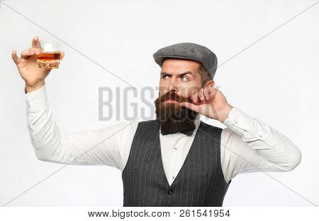 Degustator. Man With Beard Holds Glass Of Brandy. Tasting And Degustation Concept. Bearded Businessm