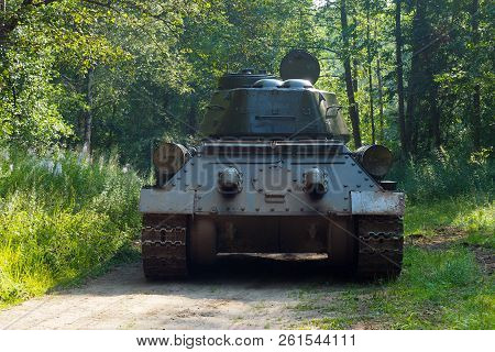 Russian Rare Tank Of World War Ii In The Woods Going. The Legendary Retro Shooting Military Tracked 