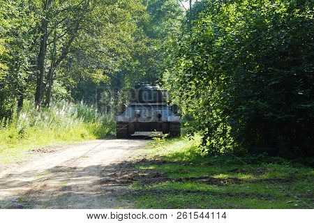Russian Rare Tank Of World War Ii In The Woods Going. The Legendary Retro Shooting Military Tracked 