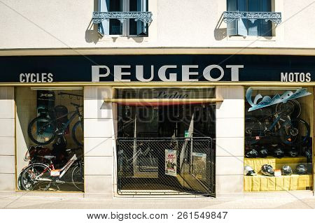 Chambery, France - May 5, 2016: Facade Of Peugeot Car Dealership Garage Selling Bikes And Mopeds Acc