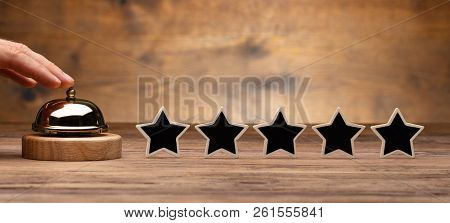 Person Ringing Service Bell Near Five Star Rating Icon