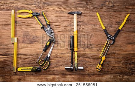 Diy Word Made Up Of Different Worktools On Wooden Surface