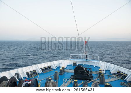 Aegean Sea, Greece/ July 17, 2018: Seaman Working On Foredeck Of Ferry Boat