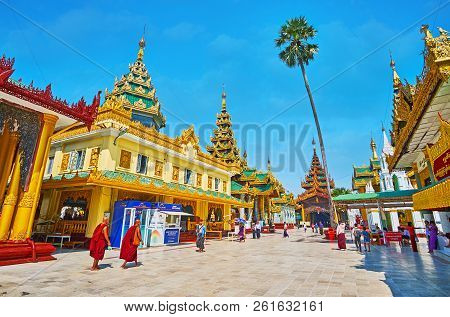 Yangon, Myanmar - February 27, 2018: The Shwedagon Pagoda Grounds With A View On Medieval Richly Dec