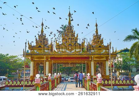 Yangon, Myanmar - February 27, 2018:  The View From The Court Of Kyay Thone Pagoda With Ponds And Br