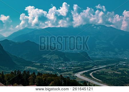 The Border Between Liechtenstein And Switzerland Seen From Triesenberg. The River Rhine Forms The Bo