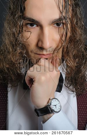 Young Handsome Boy In White Shirt With Bowtie And Curly Hair