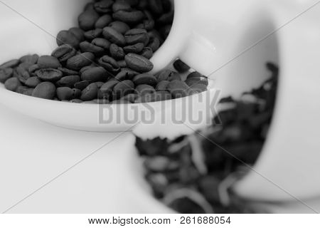 Black And White Background Of Coffee Beans And Seeds And Green Tea In Ceramic Cups
