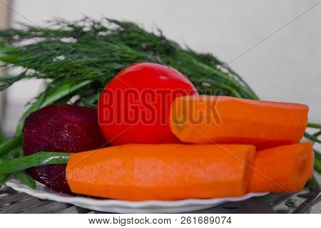 Bright Ripe Vegetables On White Ceramic Plate
