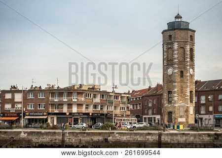 Dunkerque, France - September 16, 2018: Leughenaer Brick Clock Tower And Historic Lighthouse On Minc