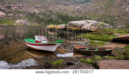 Landscape With Fishing Boats Moored On Shore. Galicia Spain