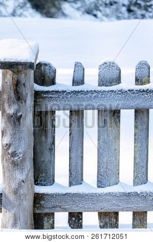 Specific Winter Season Image With A Snowy Wooden Fence, Surrounded By A Thick Layer Of Snow, On A Su