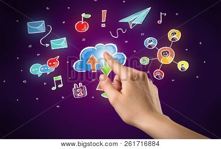 Female hand toucing mixed media icons with purple background