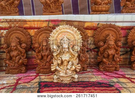 Plenty of handcrafted stautes of Goddess Laxmi kept on display in the open shop during Diwali. Cottage industry and small artisans gets benefited every year due to religious festivals in India.