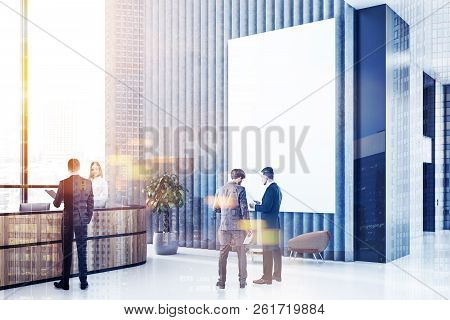 Office Reception Area With Long Reception Table, Gray And Black Walls, Panoramic Windows And Leather