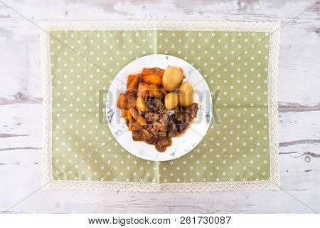 Beef meat stewed with potatoes-Traditional French cuisine Beef Bourguignon potatoes carrots in persillade
