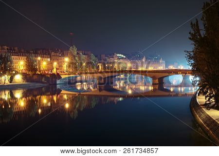 Seine, Pont Du Carrousel And Orsay At Night In Paris, France
