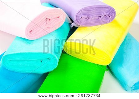 Colorful Rolls Of Fabric Are In Stock - Isolated On White Background