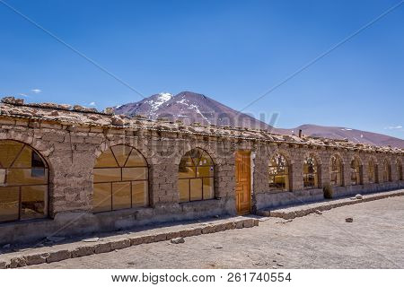 A Very Simple Hostel In The Middle Of The Andes Range Mountains In Bolivia. Volcano In The Backgroun
