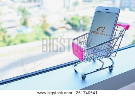 Chiang Mai, Thailand - Feb 22,2018: Apple Iphone 6s Rose Gold With Alibaba Apps In A Shopping Cart. 