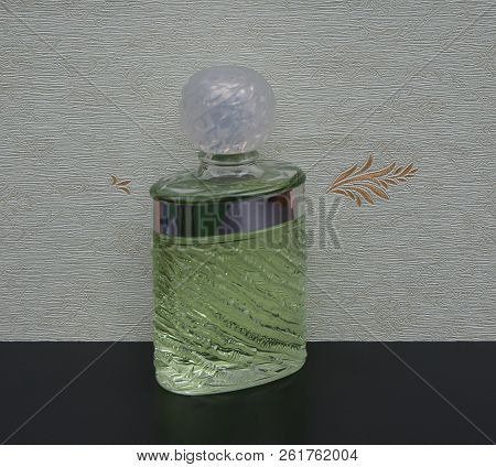 Fragrance For Ladies, Large Perfume Bottle In Front Of The Satin Wallcovering Elysee