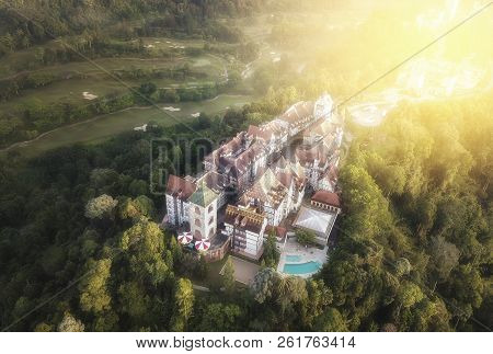 Aerial View Of French Style Building At Bukit Tinggi With Dramatic Fog And Sunrise.