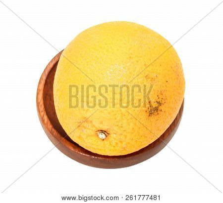 Closeup Of Single Orange Sunkist On Wooden