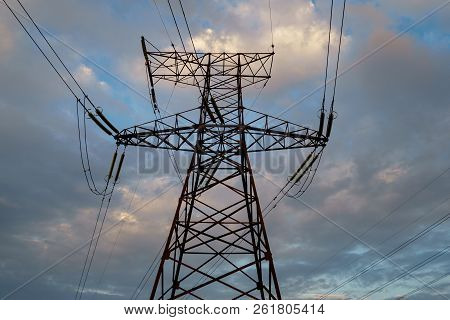 High Power Electricity Poles In Urban Area. Energy Supply, Distribution Of Energy, Transmitting Ener