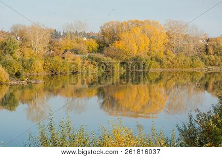 Autumn Landscape Lake. Lake At Sunset. Yellow Foliage