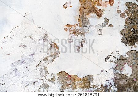 Old Plastered Brick Wall With Damaged Plaster