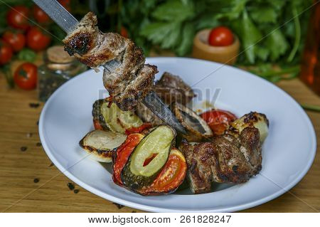 Barbecue Skewers Meat Kebabs With Vegetables On Flaming Grill