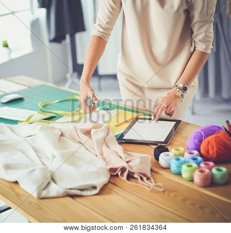 Fashion Designer Woman Working On Her Designs In The Studio.