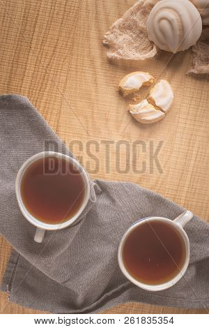 Coockies With Egg White Cover. Portuguese Sweets Known As Cavacas Served With Tea On Ceramic Cups.