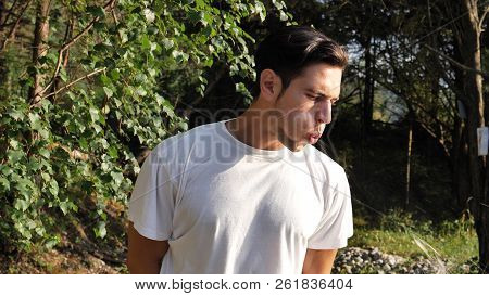 Young Rude Man Spitting On The Ground, In Nature