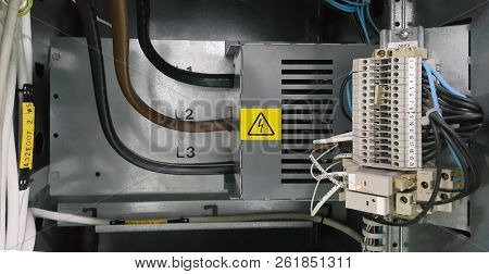 Electrical Parts And Mechanical Parts On Big Gear And Drum Rolls On White Floor