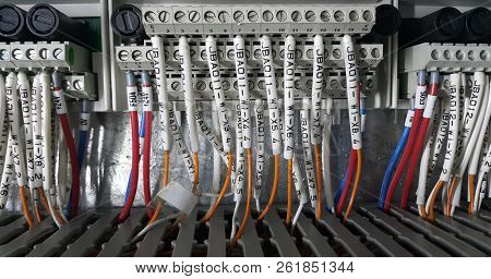 Electrical Parts And Mechanical Parts On Big Gear And Drum Rolls On White Floor