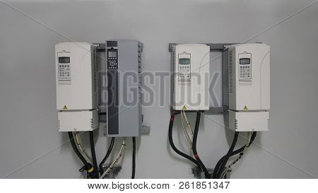 Electrical Parts And Mechanical Parts On Big Gear And Drum Rolls On White Floor