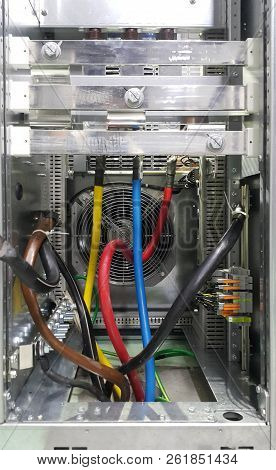 Electrical Parts And Mechanical Parts On Big Gear And Drum Rolls On White Floor