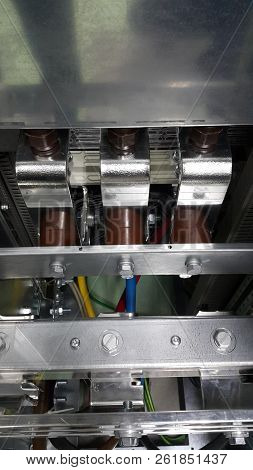 Electrical Parts And Mechanical Parts On Big Gear And Drum Rolls On White Floor