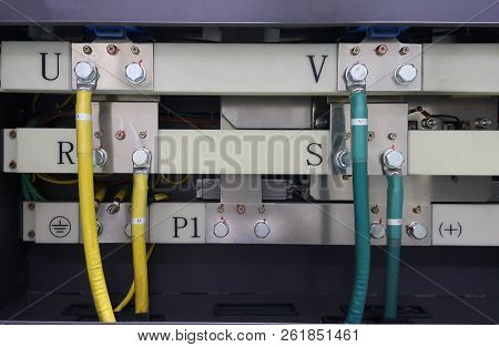 Electrical Parts And Mechanical Parts On Big Gear And Drum Rolls On White Floor
