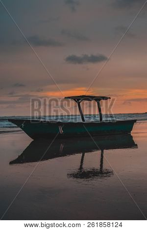 Old Fishing Boat On The Shore. Boat With Nets Waiting For Fishermen On The Beach Of Samara.