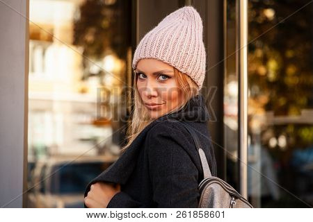 Portrait Female Student On Bright Background. Beautiful Modern Urban Young Woman Wearing Pink Knitti
