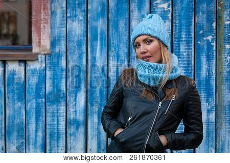 Portrait Female Student On Bright Background. Beautiful Modern Urban Young Woman Wearing Blue Knitti