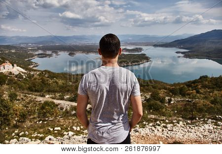 Slansky Lake. The Young Man Looks At The Lake. A Man Admires The Beauty Of Montenegro. Montenegro, S