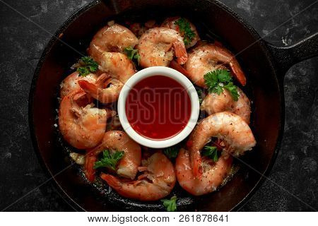 Fried In Garlic Butter Shrimps Served With Sweet Chili Suace And Parsley