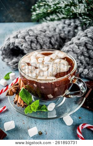 Homemade Hot Chocolate With Mint, Candy Cane And Marshmallow, Light Blue Background With Warm Blanke
