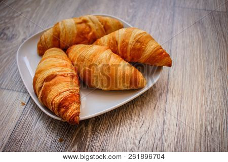 A Rich Variety Of Food Photography Croissant.
Delicious Croissants On A Square White Plate On A Wood