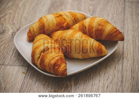 A Rich Variety Of Food Photography Croissant.
Delicious Croissants On A Square White Plate On A Wood
