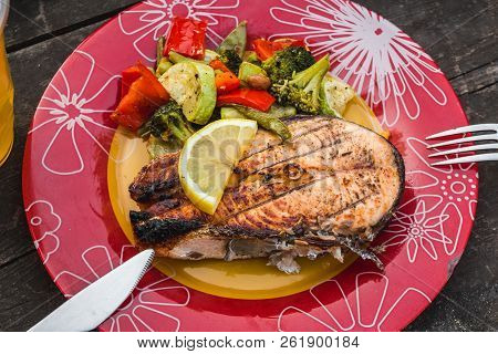 Grilled Salmon Steak With Vegetables On Plate