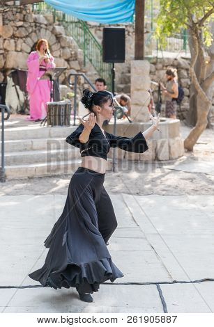 Jerusalem, Israel, September 29, 2018 : Dancer In A Black Authentic Dress Dances To The Music For Vi